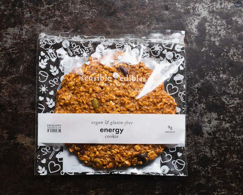 Packaged energy cookie from Sensible Edibles Bakery, labeled and wrapped in decorative packaging.