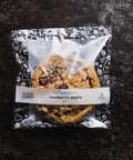 Vegan Gluten-free Packaged Mini Cranberry Apple Pie on Black Background