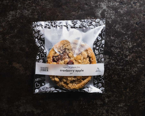 Vegan Gluten-free Packaged Mini Cranberry Apple Pie on Black Background