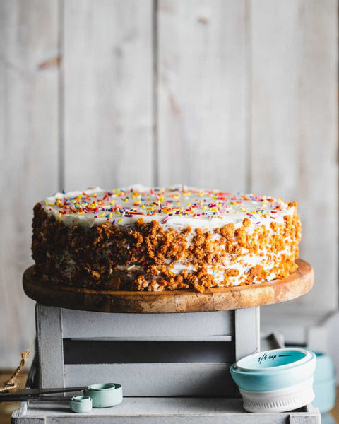 Vegan & Gluten-Free Vanilla Birthday Cake with Sprinkles on a Cake Stand