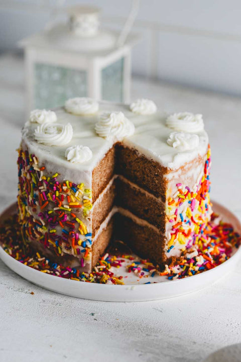 6-inch Vanilla birthday cake with white frosting and rainbow sprinkles.