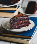 Vegan & Gluten-Free Chocolate Fudge Cake Slice on White Plate