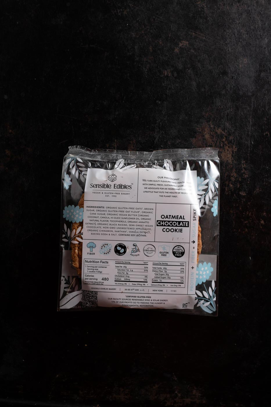 Oatmeal chocolate cookie in packaging turned around to see ingredients and nutrition facts