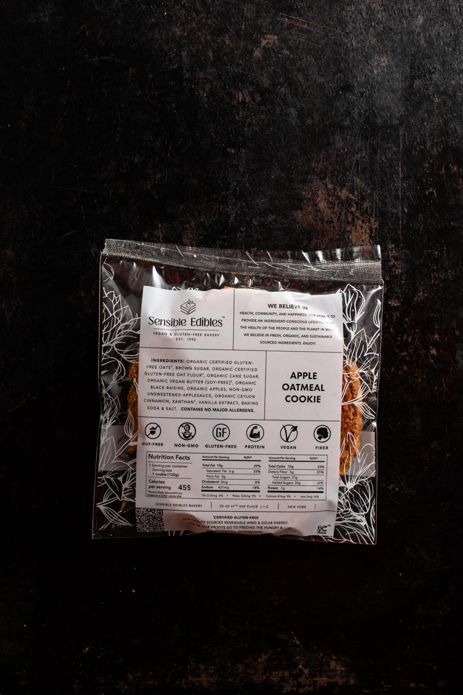 Apple oatmeal cookie in packaging turned over to show ingredients and nutrition facts