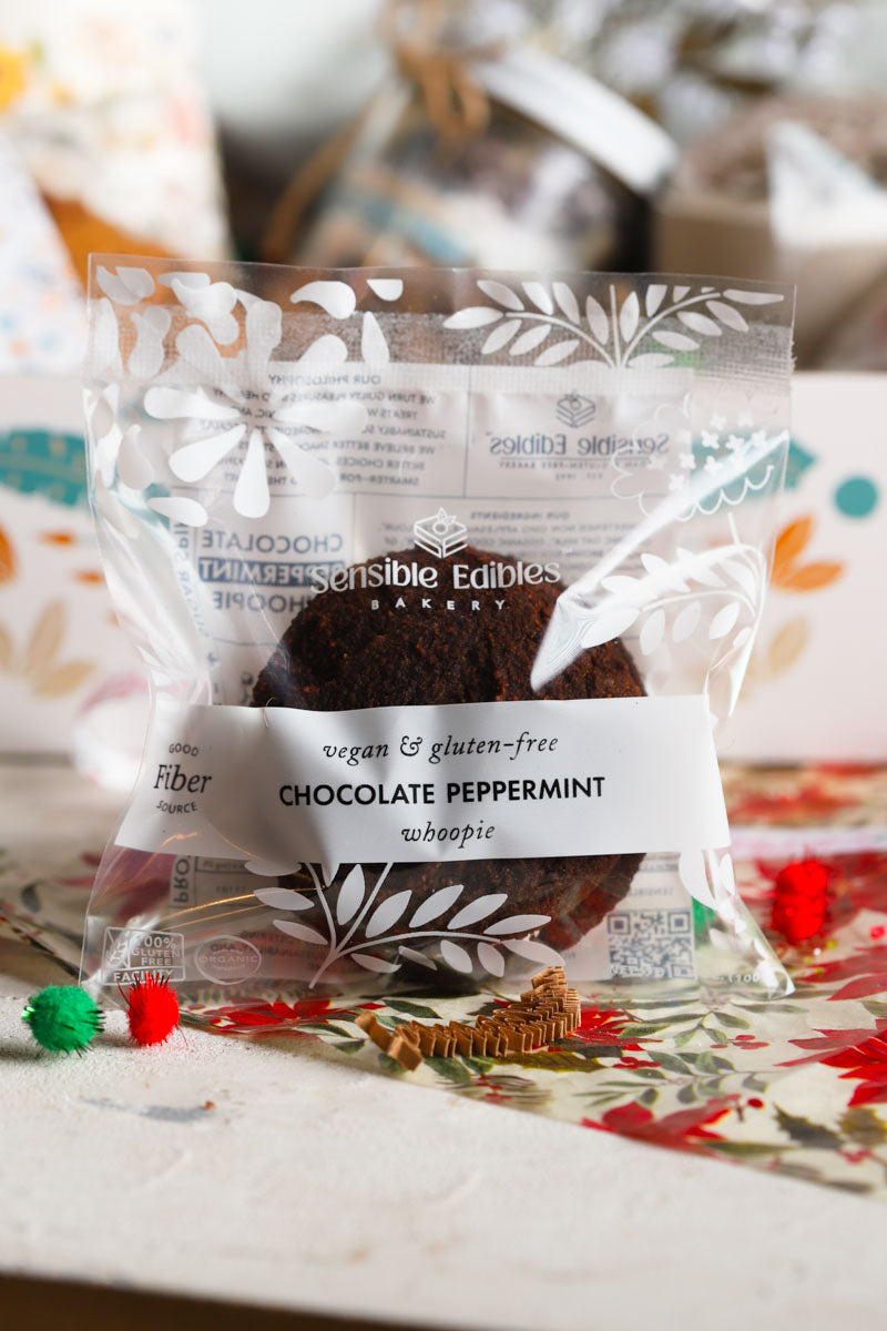 Packaged chocolate peppermint whoopie on a patterned surface