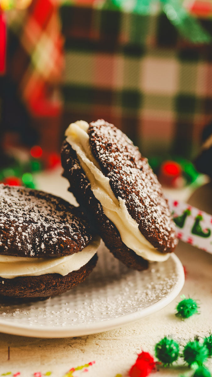 Chocolate peppermint whoopies on a plate with a festive background