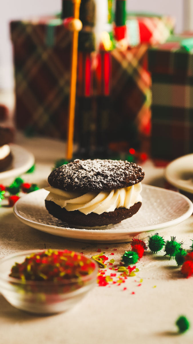 Chocolate peppermint whoopies on a plate with festive decorations