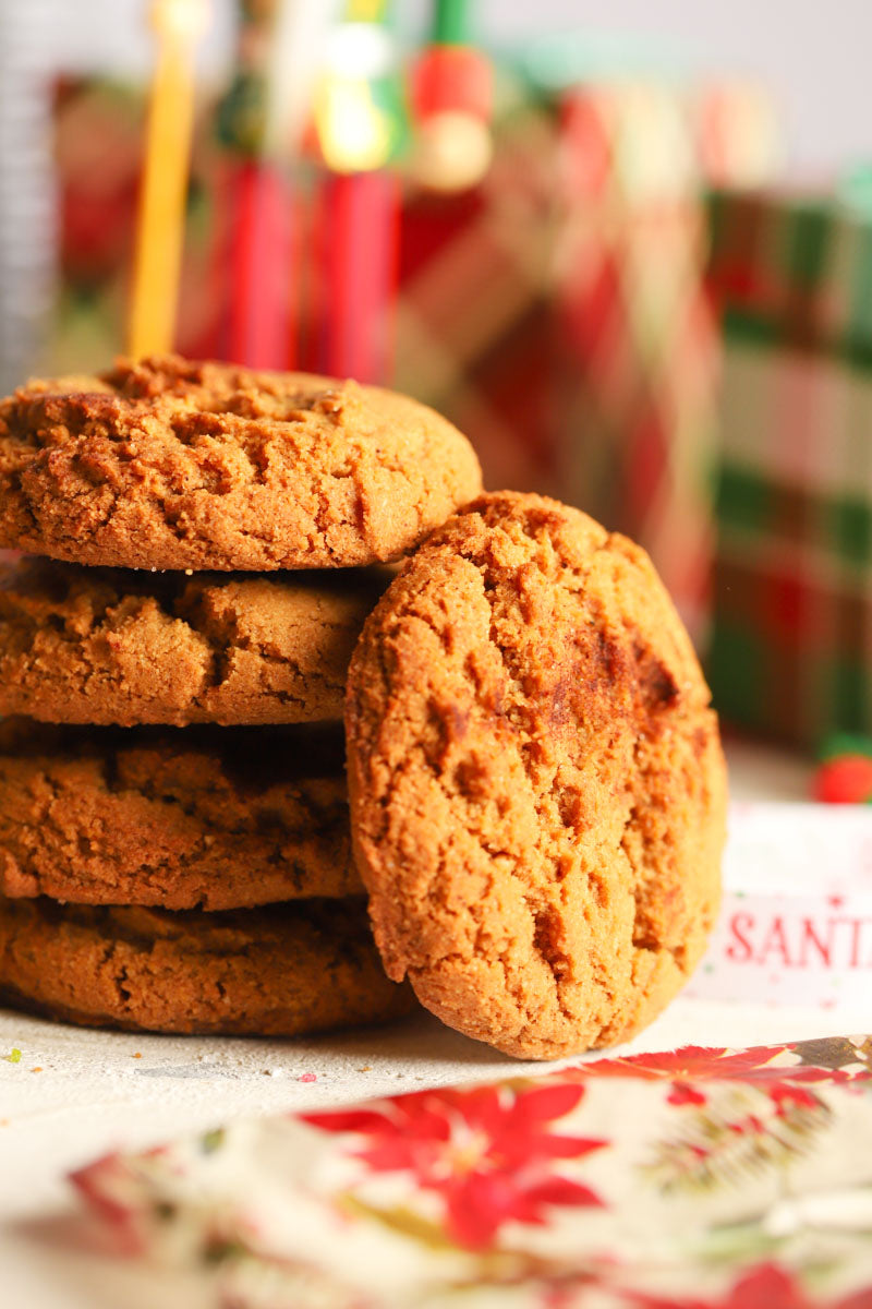 Stack of ginger spice cookies with a festive background