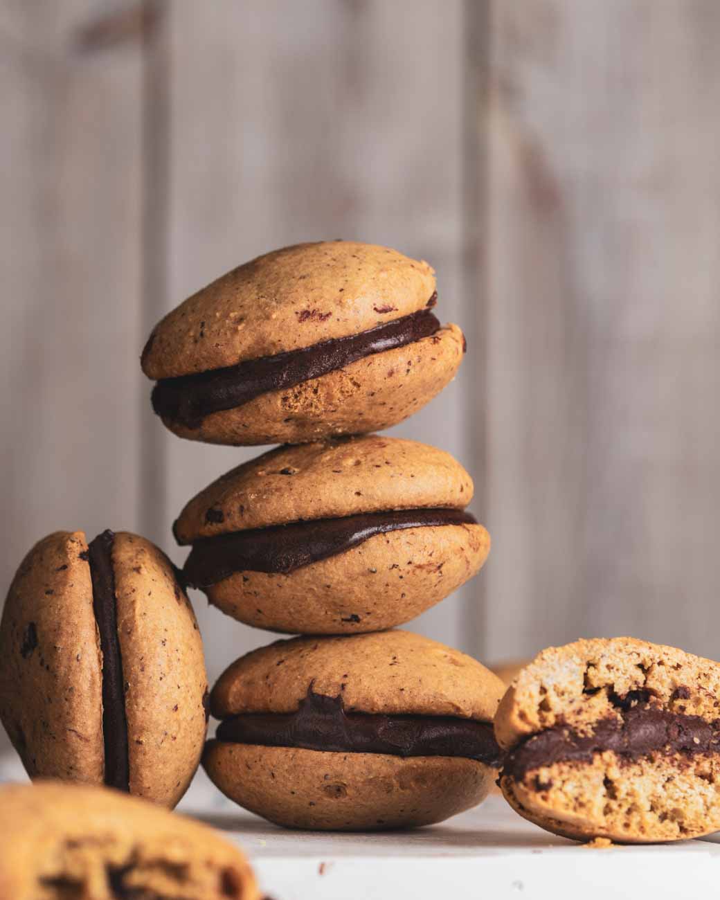 Stacked chocolate chip cream whoopie pies with a rich chocolate filling.
