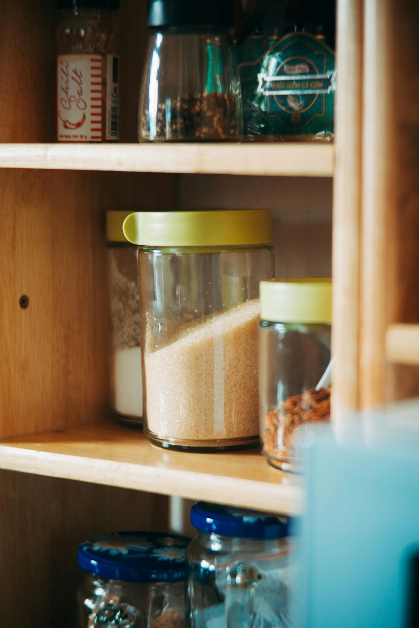 A pantry with sealed jars of dry baking ingredients