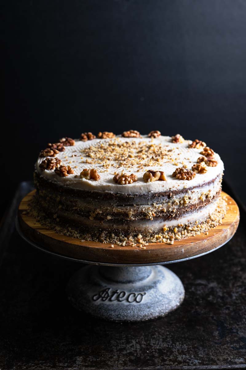Banana walnut cake on a cake stand.