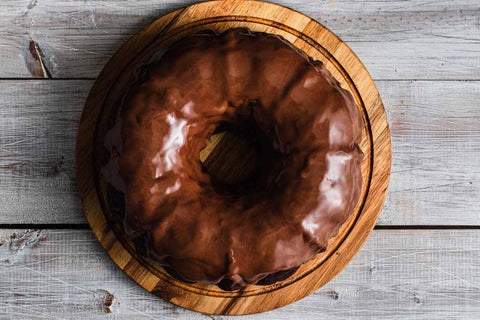 Vegan & Gluten-Free Cocoa Bean Bundt on Wood Plate