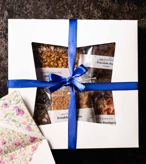 Vegan and Gluten-Free Desserts in White Box With Blue Ribbon Bow and Card