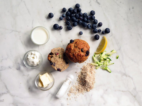 Low-Sugar & Gluten-Free Lemon Zucchini With Blueberries Protein Muffin On Marble Table