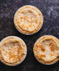 3 Vegan & Gluten-Free Mini Coconut Custard Pies on Black Background