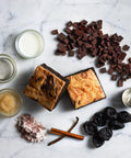 Vegan & Gluten-Free Cheesecake Brownie with Ingredients on Marble